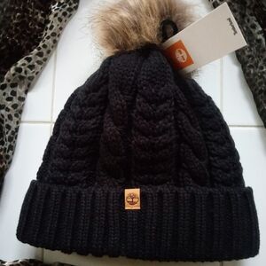 Timberland Black Cable Knit Beanie with Brown Pom